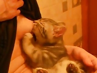 Russian Woman Breastfeeding A Cat 